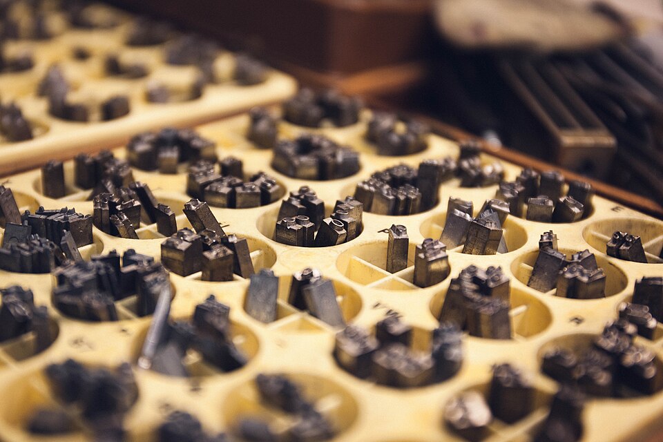 Metal letterpress type sorted in a tray